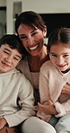 Laugh, relax and face of family on sofa in home with bonding, love and connection together. Tickling, happy and portrait of mother with children for support, care and safety in living room at house.