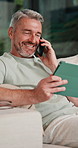 Tablet, phone call and man on sofa in home with communication for online finance information. Laugh, digital technology and mature male person on mobile conversation for blog on investment at house.