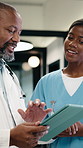 Doctor, nurse and discussion in clinic with tablet, mentorship and research for medical internship. Black people, talking and manager in hospital with tech, training intern and advice for healthcare.