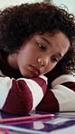 Girl, bored and sad with book for homework for project, learning disability and exhausted in lounge. Child, notes and frustrated with stress, problem solving and drawing with creativity at house