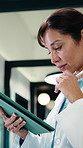 Doctor, tablet and woman thinking for medical solution, treatment or diagnosis in hospital. Telehealth, happy and mature physician with tech for review, reading or good results of clinical report