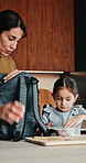 Mom, child and lunch with school bag in kitchen for morning preparation, academic support or help. Mother, kid or getting ready with daughter packing backpack for snack, meal or nutrition in house
