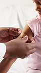 Doctor, hands and kid with plaster on bed for immunization or medical injection in home visit. Healthcare, pediatrician and child with first aid bandage for nursing, vaccination or wound protection