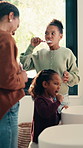 Family, children or girls brushing teeth in bathroom for oral hygiene, cleaning or morning routine. Grooming, happy people and kids with mother for dental care, getting ready and bonding in home