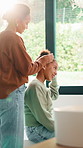 Mom, child or grooming with hair in home for morning preparation, styling or beauty together. Mother, hug or helping daughter with hairstyle, gratitude or thank you for support, love or care in house