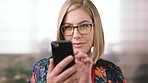 Business, phone and woman with glasses typing, scroll or search on app for website, contact or about us. Online, internet and person with reading, communication and office with smile for marketing