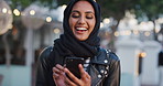 Phone, scroll and Muslim woman in city with laugh, social media joke and funny text message at night. Evening, bokeh and happy Islamic person in urban town with tech, internet humor and online meme.