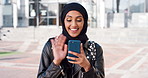 Student, phone or Muslim woman at college with video call, blow kiss or wave for online communication. Happy, Islamic person and tech at university outdoor with virtual contact, greeting and talking.