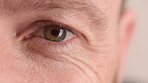 Eye care, face and vision with person closeup for optometry, eyesight or glaucoma exam. Mature, ophthalmology or ocular health with iris, contact lens or portrait with optical assessment for wellness
