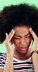 Pain, headache and woman in studio with stress, tension and student debt on green background. Migraine, sick and African person with brain fog, bad results and scholarship loss with loan crisis