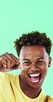 Happy man, face and excited with dancing in studio, celebration and movement on green background. Person, smile and dancer with rhythm, achievement and confident with success with goal in Costa Rica