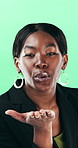 Face, businesswoman or blow kiss in studio for flirting, romantic gesture or smile for valentines day. Portrait, happy and black person with affection reaction for love, emoji or green background