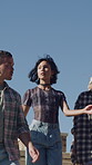 Fashion, walking and friends in city for cool, trendy and streetwear for summer. Confident, serious or outfit for group of people or man and women on outdoor stairs, urban or town with casual clothes