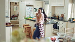 Woman, active and dance with headphones in kitchen, meal prep and move with energy in home and silly. Happy person, singing and rhythm with phone for music, cooking and celebration with tech in house