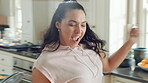 Dance, celebration and woman in kitchen with energy for excited, performance and expression. Dancer, movement and female person with hip hop or groove for rhythm, entertainment or weekend fun in home