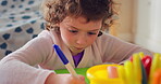 Home, child and writing with paper for learning, education or creative activity in living room. Art, drawing and girl kid with cognitive development, motor skills or imagination for growth and color