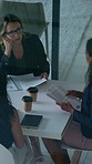 Leave, meeting and business women with paperwork, case discussion and review evidence for lawsuit. Above, fraud dismissal planning and corporate lawyer with team in glass office, document and done