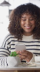 Laughing, text and woman in cafe with phone, online communication and comic post on social media. Happy, digital or African person in coffee shop with tech, funny message or meme reaction on chat app