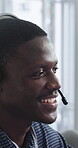 Computer, headset and support with happy man in call center for advice, consulting or feedback. Assistance, contact and solution with agent in coworking office for communication or customer service