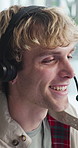 Headset, laughing and support with man in call center for advice, consulting or feedback. Assistance, contact us and solution with funny agent in office for communication, crm or customer service
