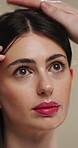 Haircare, thinking and woman with stylist for styling, salon treatment or hair maintenance. Serious, reflection or girl with hairdresser tools on studio background for grooming, cosmetology or shine
