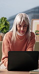 Laptop, happy and woman on sofa in home with online budget, investment or savings planning. Computer, smile and mature female person in living room with website for advice on finance blog in house.