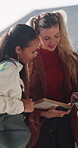 College, student and friends with book, outdoor and exam preparation with info and academic research. Learner, reading and people with textbook for education, learning and scholarship opportunity