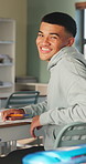 Smile, classroom and face of man at university with confidence for education in lecture. Happy, study and portrait of male student with pride for studying, knowledge or lesson at college campus.
