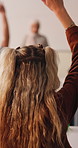 Student, woman and question in college with raised hand, learning skills and participation for lecture. Back, person and query in university class with course assessment, knowledge quiz or education.