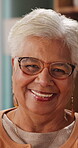 Face, glasses and senior woman in home with smile, retirement wellness and laughing for weekend break. Portrait, eyewear and elderly person with happiness for funny joke, relax and humor in apartment