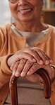 Hands, cane and elderly woman in home for support, relax and happy for balance in retirement. Walking stick, senior person with disability and smile in house with mobility aid, wellness and self care
