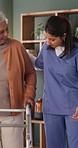 Physical therapy, nurse and help old woman with walker, wellness or patient rehabilitation in clinic. Caregiver, support and mobility assistance for elderly person with disability and senior care