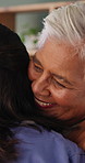Happy, caregiver and old woman in nursing home with hug, wellness and bonding together for support. Nurse, embrace and senior person in retirement center with help, trust and kindness for healthcare.