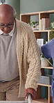 Physical therapy, nurse and help old man with walker, wellness and patient rehabilitation in clinic. Caregiver, support and mobility assistance for elderly person with disability and senior care