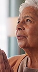 Prayer, faith or elderly woman in home for hope, worship or spiritual connection with Jesus Christ. Religion, senior person and praying to God for forgiveness, holy guidance and devotion at house