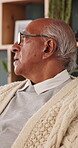 Regret, sadness and thinking with senior man in home living room for reflection or nostalgia. Memories, mistake and retirement with unhappy person in apartment for contemplation, ideas or remember