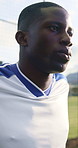 Man, jump and soccer player outdoor with stretching for training, exercise and practice for fitness. Athlete, black person and footballer with sports workout, breathe or warm up for injury prevention
