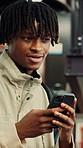 Education, phone and thinking with man at university for communication, development or social media. App, idea and typing with thoughtful college student at school for learning, study or text message