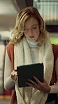 Woman, student and walking in library with tablet for learning, education or study material. Person, academic scholar or learner with digital tech for project, idea or thesis research at university