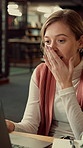 Library, laptop and excited student or woman writing notes for research or good news at university. Person, technology and shock or surprise for assignment results and education at college facility
