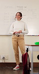 Teacher, speaking and woman in classroom with math lesson, education and knowledge. Teaching, talking and educator person in school with learning support, explaining test and curriculum question