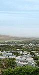 Sky, property and urban houses in neighborhood for community housing, coastal town and scenery. Aerial, mockup space and buildings outdoor with residential estate, architecture or suburban apartments