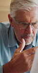 Paperwork, confused and old man in home with debt, insurance or letter of retirement risk. Thinking, worried and senior person reading of documents for financial mistake, bills or investment problem