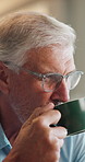 Mature, man and drinking coffee in home with smile, morning routine or satisfaction for delicious taste. Happy, person and smell espresso in lounge with mug, reflection or warm beverage for wellness.