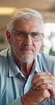 Happy, face and senior man in home for relax, chill and enjoy weekend in living room. Sofa, retirement and portrait of elderly person with smile on couch for confidence, joy and cheerful in house