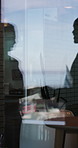 Window, shaking hands and shadow of business people in office with finance deal, agreement or partnership. Meeting, greeting and financial manager with client for investment contract handshake.