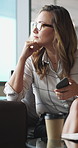 Woman, phone and thinking in sofa at office with coffee break, glasses and smile at finance company. Person, happy and virtual chat on couch with typing, app and notification at investment agency