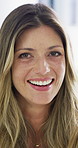 Woman, face and smile at startup in office with confidence, pride and coworking with career at company. Person, happy and portrait at workplace, professional and project management at creative agency
