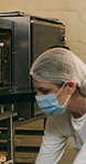 Baking, mask and oven with woman in kitchen for cooking, pastry production or process. Appliance, dough and rolls with baker or chef in commercial cafe for preparation of fresh confectionery or food