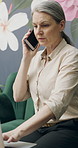 Woman, talk and phone call in small business with laptop, planning and feedback for florist company. Mature person, communication and tech in flower shop for contact, startup or typing with computer.